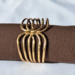 Gold toned bracelet.